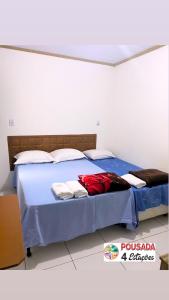 Cama ou camas em um quarto em Pousada 4 estações