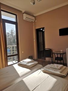 Letto o letti in una camera di FRESH Hotel Kobuleti