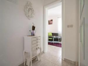 a hallway with a white dresser and a living room at Villa Jelena in Dračevica +23 photos