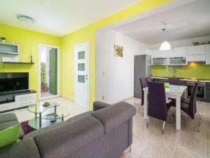a living room with a couch and a table at Villa Jelena in Dračevica