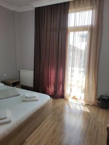 Letto o letti in una camera di FRESH Hotel Kobuleti