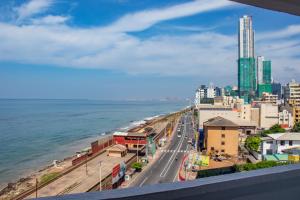 a view of a city and the ocean at Serene Sea View By Chana in Colombo