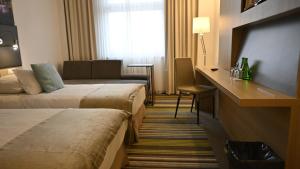 Кровать или кровати в номере Vestil Hotel