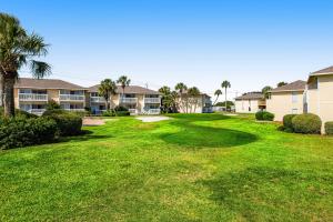 a large yard in front of condos at ​Sandpiper cove in Destin