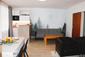 a living room with a couch and a table at Tauern in Kaprun
