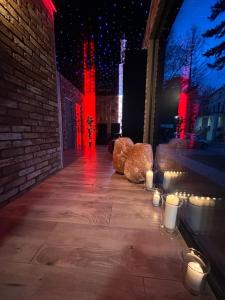 a group of teddy bears sitting on a sidewalk with lights at Ośrodek Promenada- Faleza in Jastrzębia Góra