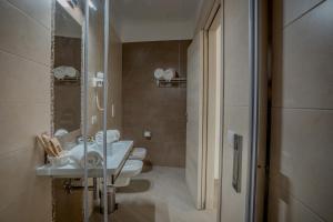 Koupelna v ubytování Tufo Bianco Relais