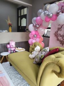 a room with a couch with a bunch of balloons at @ 21 Guest House in Pietermaritzburg