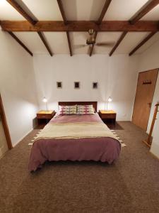 Ένα ή περισσότερα κρεβάτια σε δωμάτιο στο casa Pucón