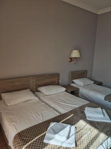 Letto o letti in una camera di FRESH Hotel Kobuleti