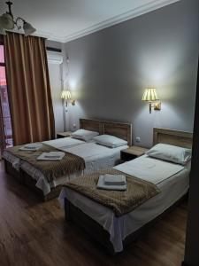 Letto o letti in una camera di FRESH Hotel Kobuleti