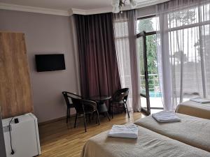 Letto o letti in una camera di FRESH Hotel Kobuleti