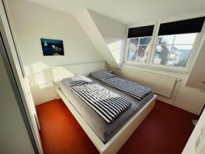 מיטה או מיטות בחדר ב-Turmresidenz App. 9