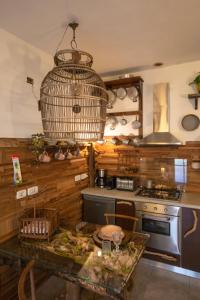 a kitchen with a table and a bird cage at La Serra Sognante Guest house con giardino in Florence