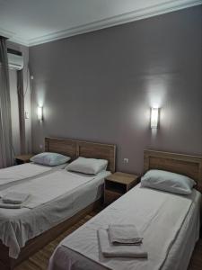 Letto o letti in una camera di FRESH Hotel Kobuleti