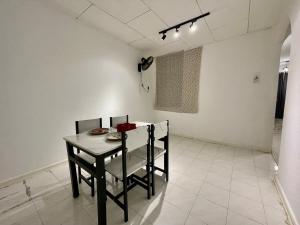 a dining room with a table and chairs at Home39#4pax#jpnstyle#netflix#NearIconCity in Bukit Mertajam +25 photos