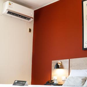 Postel nebo postele na pokoji v ubytování Rua Hoteles Talara