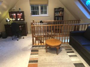 a living room with a couch and a table at Burraton Cob in Exeter