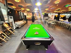 a pool table in a room with a pool table at DLUXE PREMIUM HOTEL in Port Harcourt