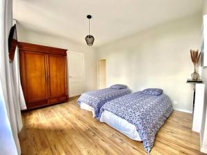 Ένα ή περισσότερα κρεβάτια σε δωμάτιο στο Appartement 2 chambres complet chic et cosy