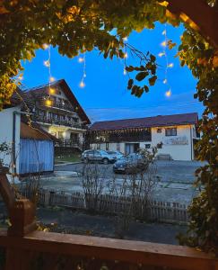 a view of a building with cars parked in a parking lot at Pensiunea Irina Maramureș in Deseşti