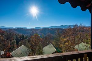 a view of the mountains from the deck of a cabin at Spacious Smokies Cabin - Hot Tub with Mountain Views in Gatlinburg