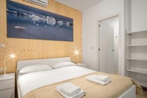 a bedroom with a bed with two towels on it at 1 bedrooms 1 bathroom furnished - La Latina - modern - MintyStay in Madrid