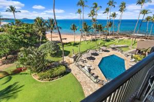 an aerial view of a resort with a swimming pool and the beach at Mana Kai 410 - Ocean front at Keawakapu Beach, AC in Wailea
