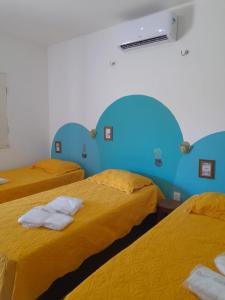 En eller flere senge i et værelse på Doce Villa