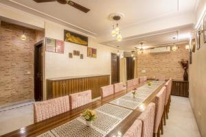 a conference room with a long table and chairs at Hotel The Sunrise View - Corporate Stay Hotel in Noida