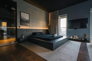 TV a/nebo společenská místnost v ubytování ETERN Apart Hotel