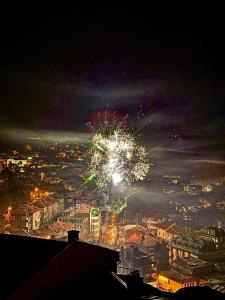 a fireworks display over a city at night at TOP SKY VIEW - Studio Panorama in Veliko Tŭrnovo