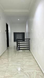 a empty room with a bench in the middle of it at Blueocean.cog in Benin City