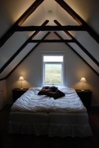 Łóżko lub łóżka w pokoju w obiekcie Grand Guesthouse Gardakot