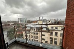 a balcony with a view of a city at Spacious Manchester Studio with Balcony City Views in Manchester