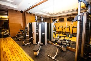 a gym with rows of treadmills and machines at Gorrion Hotel Istanbul in Istanbul