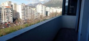 a balcony with a view of a city with buildings at Happy Place apartment 1 bedroom in Bar