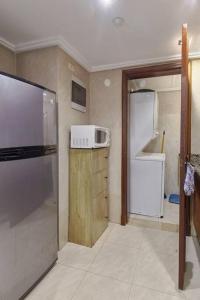 Kuchyň nebo kuchyňský kout v ubytování Luxurious Ocean View Suite