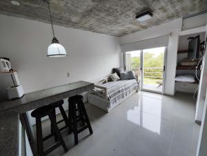 a living room with a couch and a table at Mar, Bosque y Lago in José Ignacio