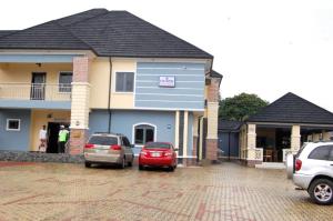 two cars parked in front of a house at STARSAPPHIRE LUXURY HOTELS LTD 