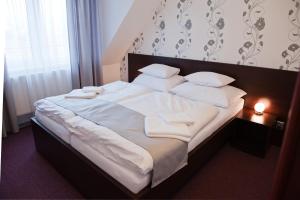 Postel nebo postele na pokoji v ubytování Hotel Vír