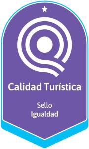 a purple and white sign with a spiral at Neuquén Tower Hotel in Neuquén