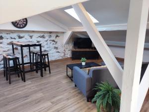 a living room with a couch and a table at Loft Cosy NICE centre ville in Nice