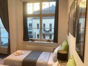 Ein Bett oder Betten in einem Zimmer der Unterkunft Downtown Apartments Leipzig