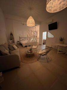a living room with a couch and a table at Studio 45qm in Calpe Altstadt - ruhig & modern in Calpe