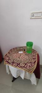 a table with a table cloth on top of it at Koonamparayil Home Stay Munnar Anaviratty-Family Only in Anaviratty