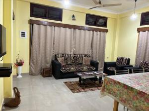 a living room with a couch and a table at Nivriti (Bliss) Homestay in Guwahati