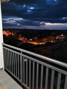 a balcony with a view of a city at night at HG3 Jelah Stan na Dan in Jelah