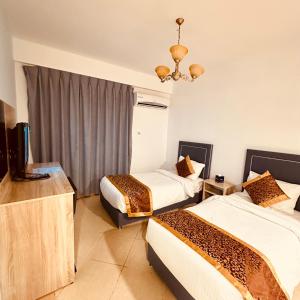 Postelja oz. postelje v sobi nastanitve Aquavista Hotel & Suites