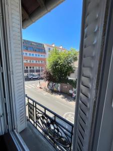 a view of a street from a balcony at MA - Maison 10 min PARIS EXPOS - 9 rooms/12 beds in Malakoff